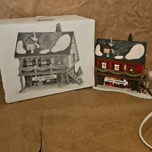 Dept 56 North Pole Series Santa’s Woodworks  with light cord/box